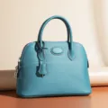 Classic dome leather handbag for women, top handle turquoise shoulder bag with metal lock. - Teal