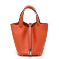 Borsa a secchiello arancione in vera pelle da donna, design elegante con lucchetto. - 22 cm Arancione (fibbia argentata)
