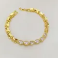 Bracciale dorato a farfalla con zirconi bianchi ovali, elegante accessorio di moda. - Bianco Ovale