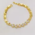 Bracciale maglia farfalla dorata con dettagli in zircone cubico triangolo brillanti. - Triangolo Bianco