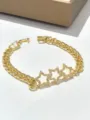 Bracciale a catena dorata alla moda con ciondoli a stella in strass scintillanti per donne. - Pentagramma