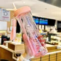 Pink plastic water bottle with straw and portable strap, large capacity student cute drink cup. - 800ml / Pink