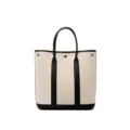 Sac cabas vertical en toile beige avec garniture en cuir noir, élégant et grand. - Noir