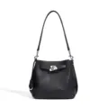 Black genuine leather bucket bag with top handle and metal lock closure for women. - Black