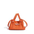Elegante bolso de cuero para mujer, elegante bolso de hombro naranja con cierre metálico. - Naranja