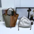 Sac seau en cuir véritable bicolore avec poignée et pochette intérieure à cordon. - 18 Gris éléphant et brun doré