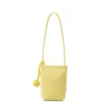 Yellow leather vertical phone bag with stylish knot strap, compact crossbody design. - Chick Yellow