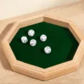 Wooden hexagonal dice tray with green felt lining and five white dice for board games. - Octagonal Flap Board Game