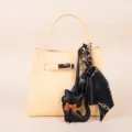 Light yellow leather handbag with black silk scarf and cute kitten charm pendant accessory. - Black Tassel Scarf and Black Kitten