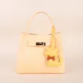 Cute yellow leather handbag with metal turn lock and kitten charm for women daily fashion style. - BHT07 Yellow Kitten