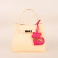 Chic light yellow leather handbag with cute pink cat pendant, stylish minimalist daily bag. - BHT07 Rose Red Kitten