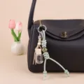 Mini essential oil glass bottle bag charm, stylish car perfume pendant detail view. - TSS06