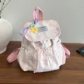 Zaino scolastico rosa con fiocco da donna, pratico zainetto casual in tela con coulisse e patta. - Con Ciondolo / Rosa