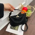 Black mini top-handle shoulder bag with metal lock, stylish design for women variant. - Black