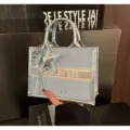 Light blue star tote bag with silver trim and star charm for stylish women daily use. - With Charm / Blue