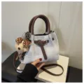 Denim bucket bag with brown leather handles, stylish casual crossbody bag with cute plush pendant. - With Charm / Blue