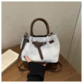 Chic denim textured bucket bag with brown leather handles, stylish casual crossbody purse. - No Pendant / Blue