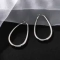 Orecchini a cerchio a goccia argentati, orecchini ovali geometrici minimalisti donna. - Argento