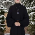 Black knit cardigan shawl for women, loose winter warm outerwear piece, outdoor detail. - Black