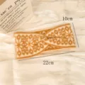 Fascia invernale lavorata a maglia con motivo geometrico a fiocco di neve, accessorio caldo. - Fascia per capelli con fiocco di neve grande - Cachi