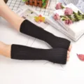 Black knitted arm sleeves, solid color ribbed sun protection arm warmers for women. - One Size / Black