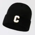 Black knit beanie hat with a stylish white and gold letter C patch, warm winter streetwear. - Adjustable / Letter C / Black
