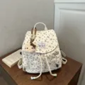 Cute corduroy backpack with sweet heart print and Hello Kitty pendant for daily use. - With Pendant / White