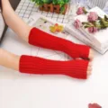 Solid color knitted arm warmers for women, cozy winter thermal sleeves, red thumb hole style. - One Size / Red