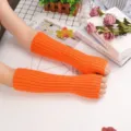 Neon orange knit arm warmers, ribbed thumb hole sleeves, stylish outdoor sun protection accessories. - One Size / Orange