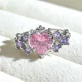 Detailed close-up of a sweet vintage silver heart ring with pink and purple cubic zirconia. - Pink Heart Purple Zirconia (JZ1970A) / Silver