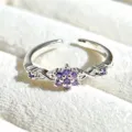 Silver-tone open ring featuring a purple cubic zirconia flower cluster with dainty side details. - Purple Round Zirconia Flower (JZ2211A) / Silver