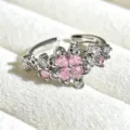 Close-up detail of silver open ring featuring pink heart-shaped stones in flower clover shape. - Adjustable Open / Pink Heart Combined Flower Style (JZ3105A) / Silver