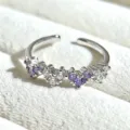 Detailed close-up of a silver-toned open ring featuring alternating purple and clear heart stones. - Adjustable Open / Purple and White Heart Eternity Ring (JZ3142A) / Silver