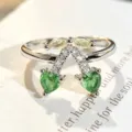 Close-up detail of a silver-toned ring featuring green heart-shaped and yellow zirconia stones. - Adjustable Open / Heart Plant Fruit Style (JZ0925A)