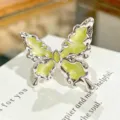 Green enamel butterfly ring detail close up shot showing unique liquid metal silver style. - Adjustable Open / Fluid Butterfly Style (JZ1027A)