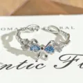 Close-up detail of silver open ring featuring a sparkling blue bow design with cubic zirconia. - Blue Zirconia Bowknot Style (JZ0186A) / Adjustable Open