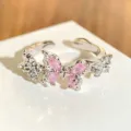 Detailed close-up view of the pink cubic zirconia butterfly open ring sparkling elegantly. - Adjustable Open / Butterfly Shape Style (JZ0828A)