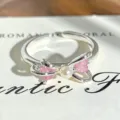 Close-up of a silver open ring featuring a bow design with pink cubic zirconia and a pearl. - Pink Heart Bowknot Style (JZ0586A) / Adjustable Open