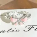 Silver open ring featuring a pink enamel bow and sparkling zircon stones for stylish wear. - Pink Enamel Bowknot Style (JZ1507A) / Adjustable Open