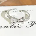 Close-up of silver bow zircon open ring, delicate crystal details and polished finish. - Exquisite Small Bowknot Style (JZ1897A) / Adjustable Open