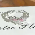 Detailed close-up of a silver open ring with a sparkling pink zircon bow and crystal accents. - Pink Marquise Bowknot Style (JZ2203A) / Adjustable Open
