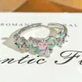 Detailed view of silver open ring showing pink zircon and green enamel bow with sparkling stones. - Green Enamel Pearl Bowknot Style (JZ3596A) / Adjustable Open