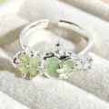 Close-up detail of the sweet enamel green apple clover silver open adjustable ring. - Clover Apple Style (JZ0246A)