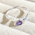 Detailed close-up of a sweet open ring featuring a pearl, purple gemstone, and enamel accent. - Pearl Purple Gem Style (JZ5452A)