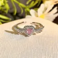 Close-up detail of the stunning pink heart zircon open ring with sparkling wing design. - Adjustable Open / Pink Diamond Wing Gem Style (JZ3524A)