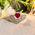 Close-up of heart-shaped red zircon open ring with sparkling crystal V-shaped details. - Adjustable Open / Red Diamond V-Shape Stacking (JZ5651)