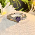 Detail shot of a stunning purple heart-shaped cubic zirconia open ring with sparkling stones. - Adjustable Open / Purple Diamond Side Accent (JZ5749)
