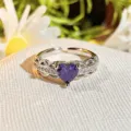Close-up of a delicate purple heart cubic zirconia open ring with sparkling pavé stones. - Adjustable Open / Purple Diamond Micro Pave Exquisite (JZ6246)