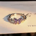Close-up detail of silver open ring featuring a sparkling purple zircon butterfly shape. - Purple Butterfly Style (JZ0192A) / Adjustable Open