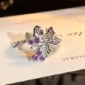 Detailed closeup shot of the silver open ring with hollow floral leaves and purple zircon. - Hollow Flower Leaf Style (JZ0794B) / Adjustable Open